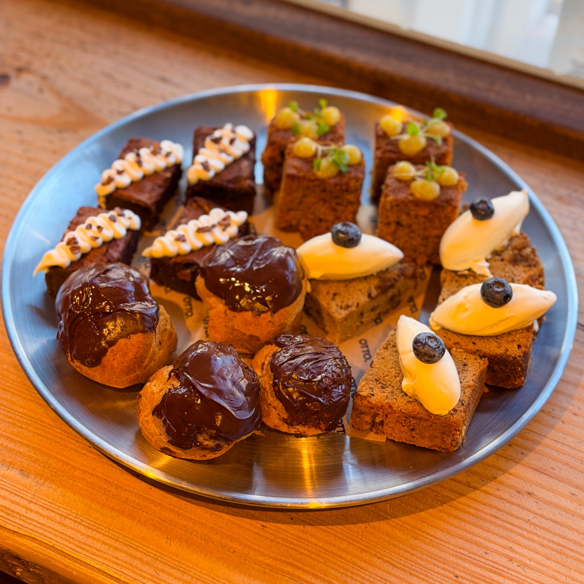 A platter of Otto cakes and chocolate-topped pastries