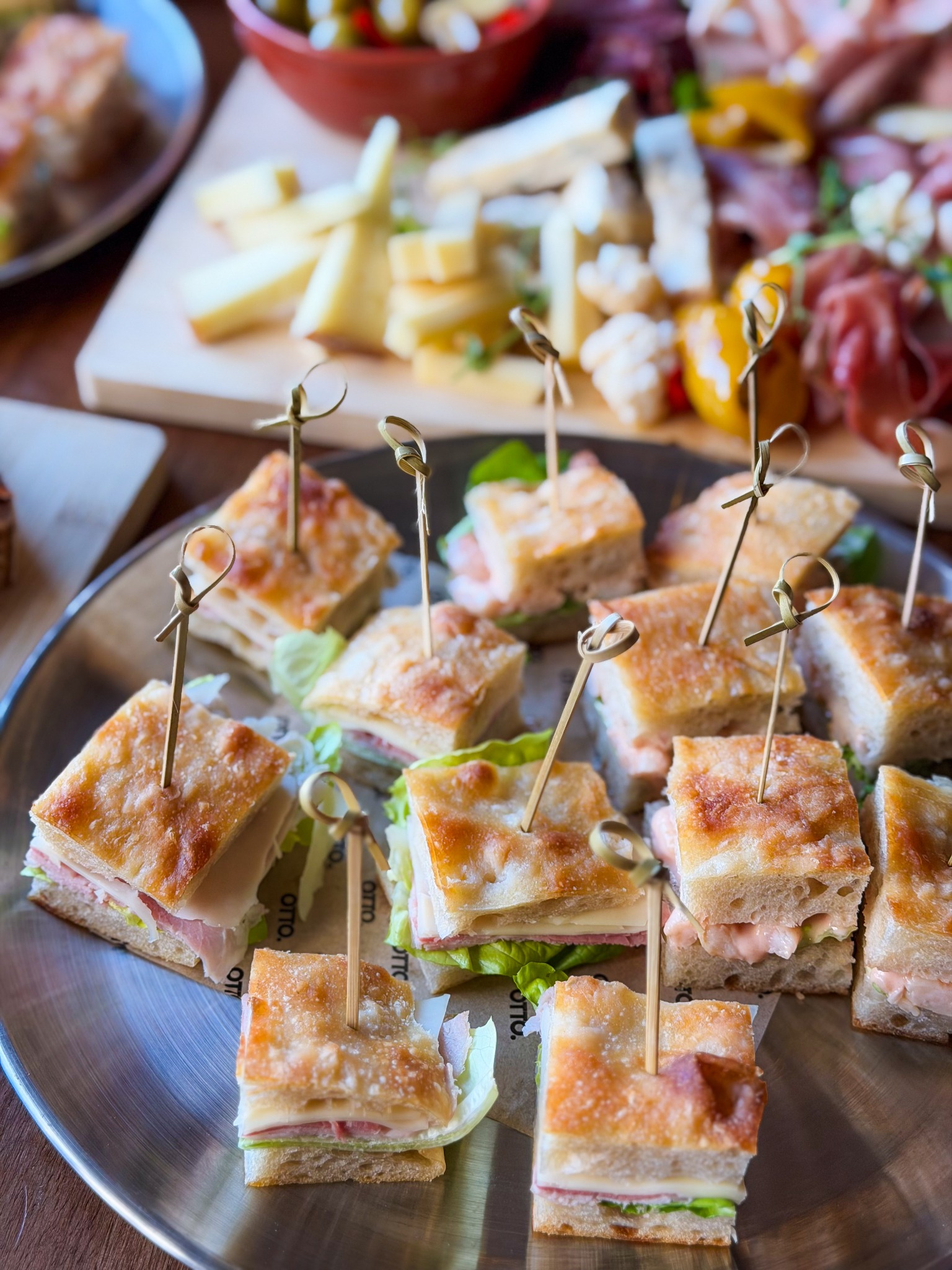 Otto focaccia sandwiches arranged on a serving platter
