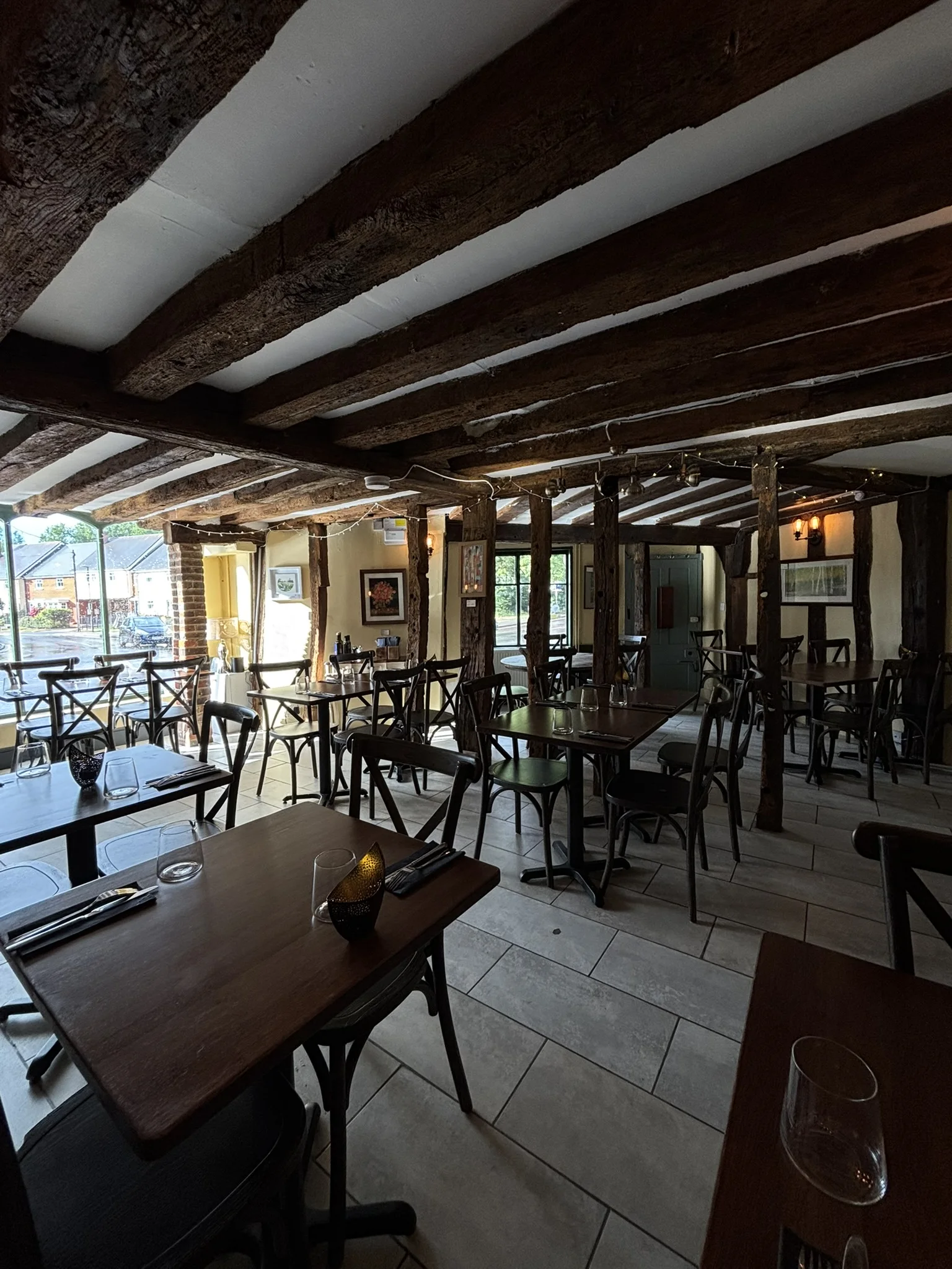 The warm timber beams and tables inside Otto