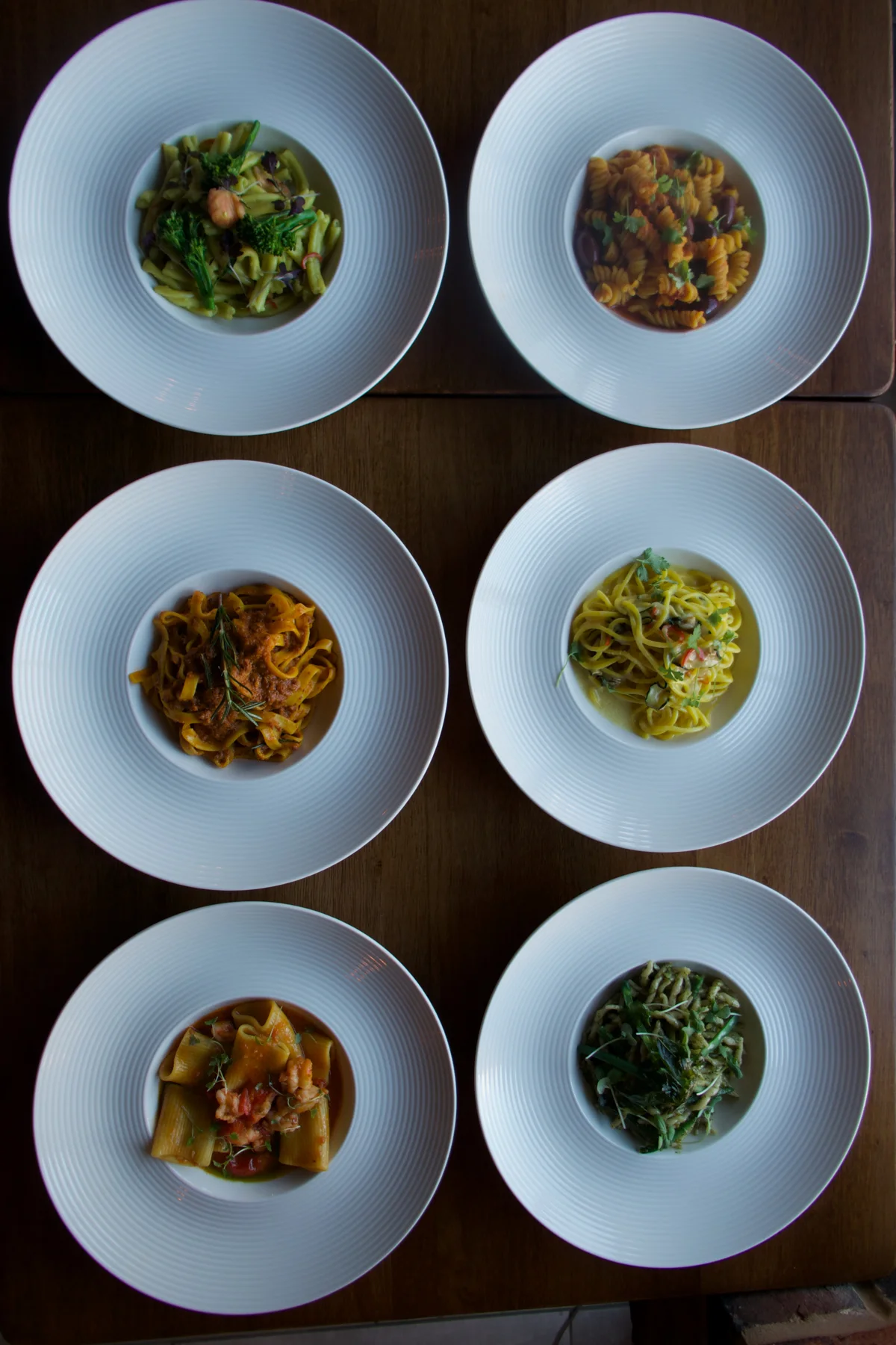A table of freshly prepared Italian dishes at Otto
